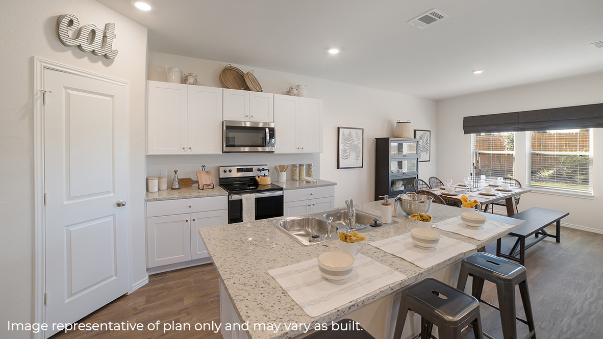 DR Horton San Antonio Laurel Vistas the nicole floor plan 2473 square feet kitchen with corner pantry, shaker style cabinetry, stainless steel appliances, granite countertops and a spacious kitchen island with sink and bar stools
