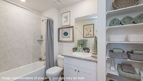 second bathroom with bathtub and shelving