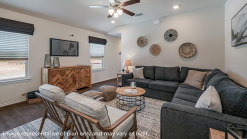 DR Horton San Antonio Riverstone at Westpointe 4922 taconite pass the diana floor plan 1 story 2 car garage 1535 square feet living room with hard surface flooring sectional couch and armchairs
