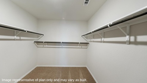 primary closet with shelving