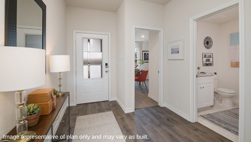 entry of home with secondary bathroom and bedrooms