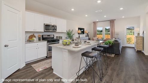 open concept kitchen flowing into living room