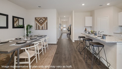 entry hall leading to dining area and kitchen