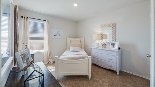 Floresville Links at River Bend New Construction Homes Girls bedroom with full bed and walk in closet