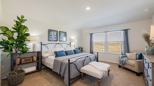Floresville Links at River Bend New Construction Homes large master bedroom with king bed