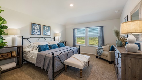 Floresville Links at River Bend New Construction Homes large main bedroom with king bed