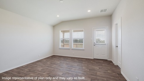 Floresville Links at River Bend New Construction Homes airy living room with natural light overlooking back patio