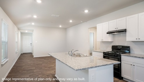 Floresville Links at River Bend New Construction Homes open white cabinet kitchen overlooking natural lit living space