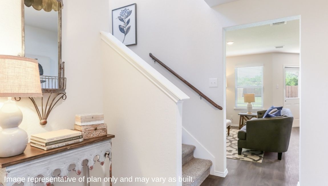 Entryway leading into spacious living area.