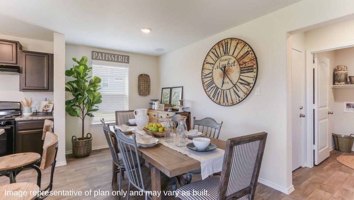 Open concept dining area facing large window.