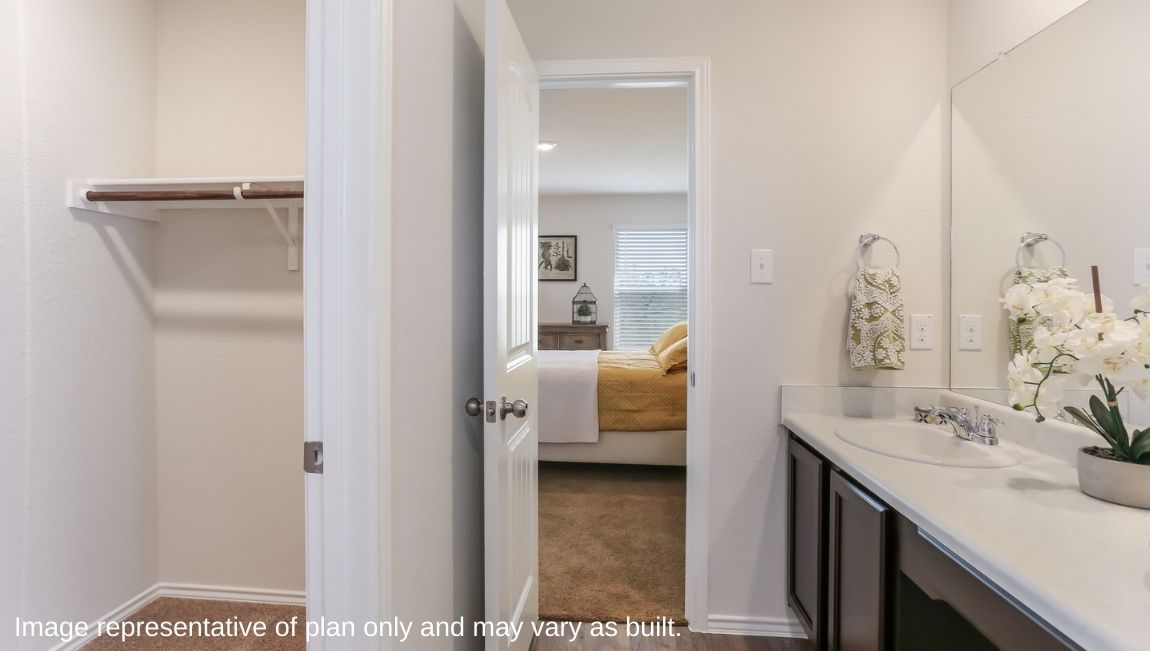 Primary bedroom with storage, hard surface flooring and plenty of counterspace.