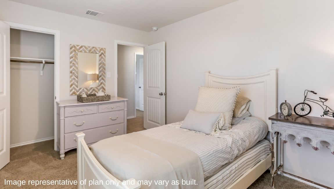 Secondary bedroom with quality carpet, window and closet.