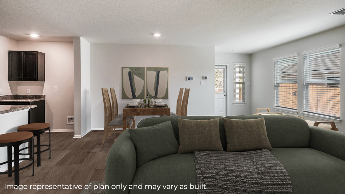 Spacious living area with hard surface flooring and windows providing plenty of light.