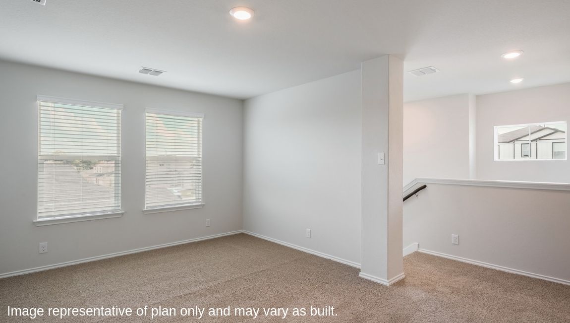 Versatile, open-concept loft leading to secondary bedrooms.