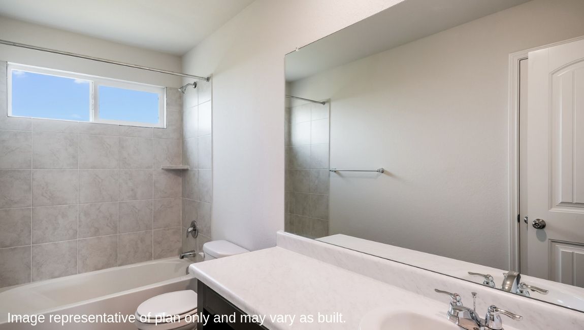 Second full bathroom with combined bathtub and shower, toilet and hard surface flooring.