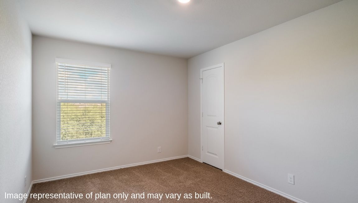 Secondary bedroom with quality carpet, window and closet.