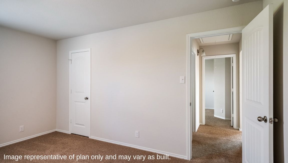 Secondary bedroom with quality carpet, window and closet.