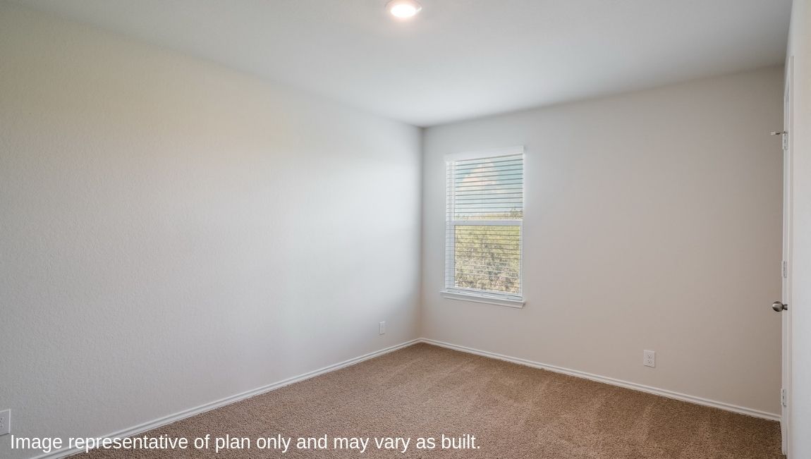 Third bathroom with combined bathtub and shower, toilet and hard surface flooring.