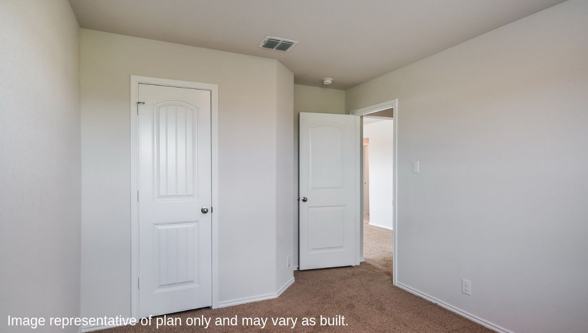 Third bedroom with quality carpet, window and closet.