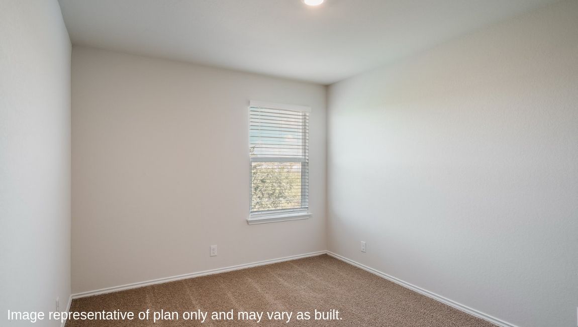 Third bedroom with quality carpet, window and closet.