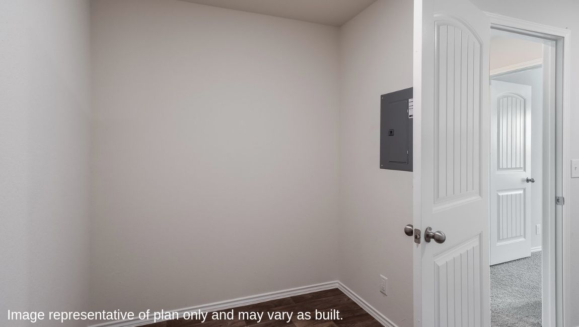 Spacious utility closet with shelving.
