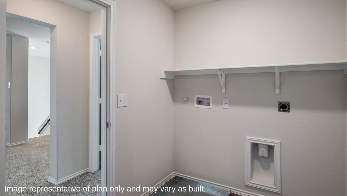 Spacious utility closet with shelving.