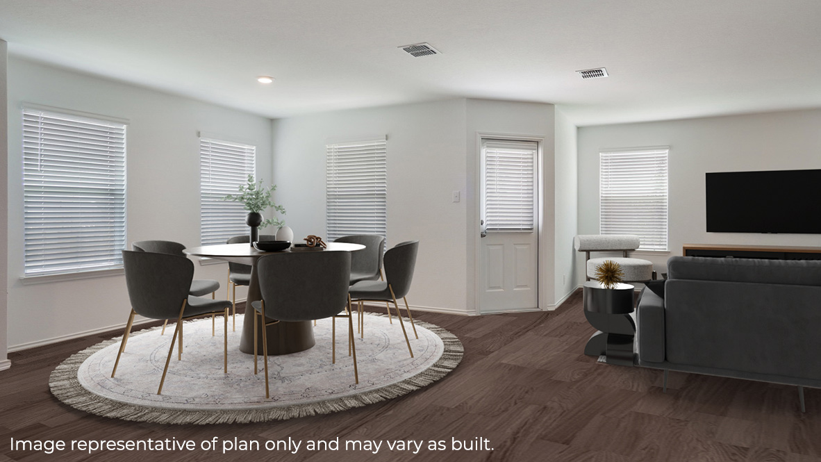 Spacious, open-concept dining area with hard surface flooring and patio door.