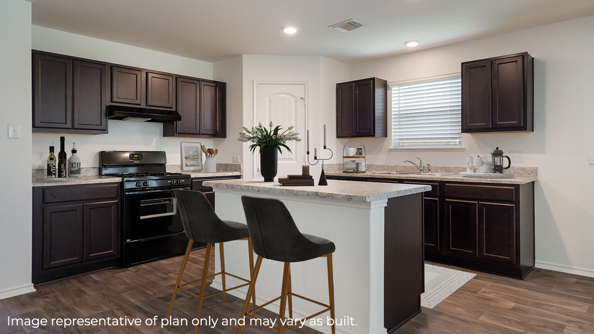 Spacious kitchen with hard surface flooring, plenty of counterspace and cabinet storage.