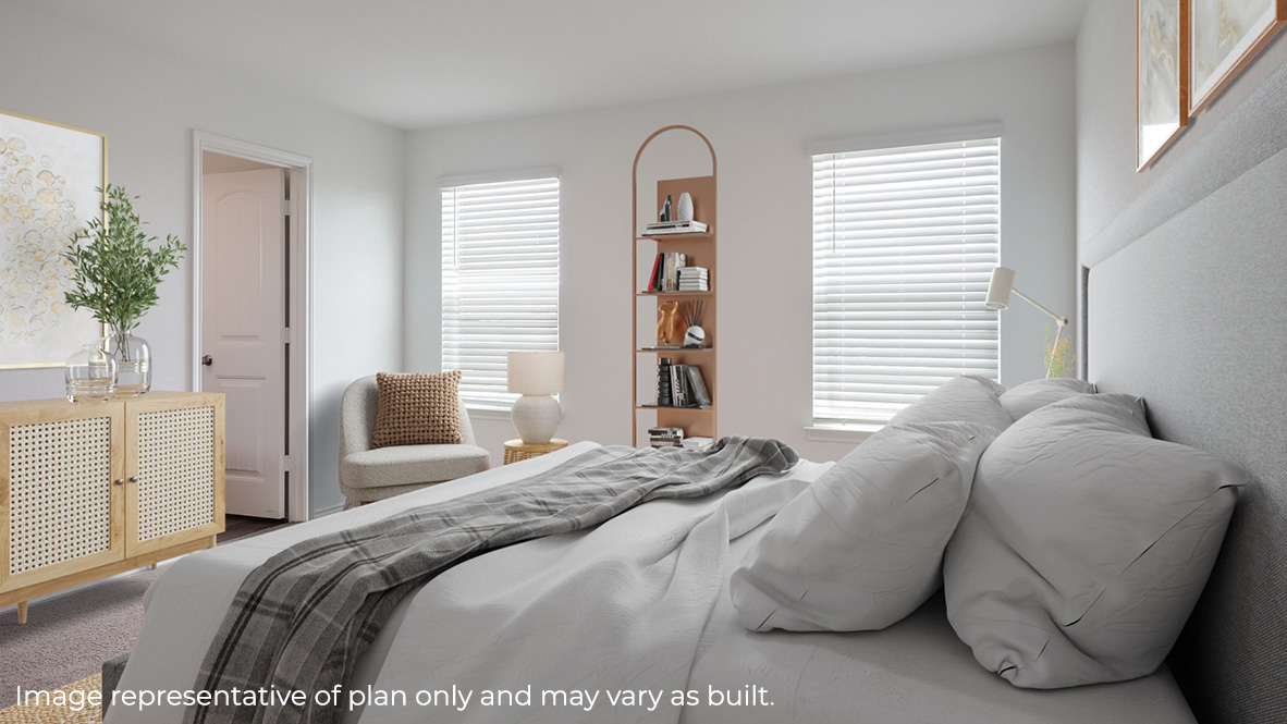 Spacious primary bedroom with quality carpet and walk-in closet.