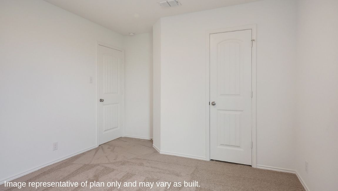 Secondary bedroom with quality carpet, window and closet.