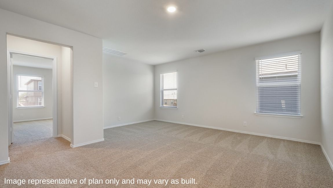 Versatile, open-concept loft leading to secondary bedrooms.