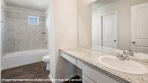DR Horton San Antonio Salado Creek primary bathroom with white cabinets and counter space with tub