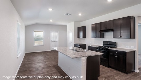 San Antonio Applewood New Construction Homes eat in kitchen and dining area with kitchen island dark cabinets and black appliances