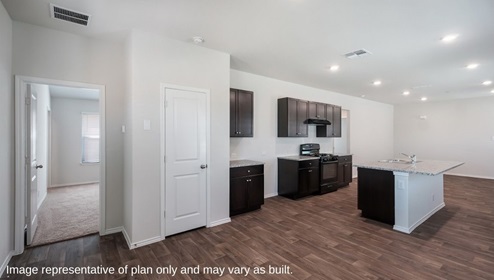 San Antonio Applewood New Construction Homes dining and kitchen with pantry dark cabinets kitchen island and black appliances connecting to main bedroom suite