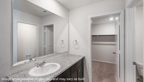 San Antonio Applewood New Home Construction main bedroom ensuite with single vanity sink and walk in closet