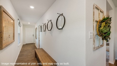 San Antonio Applewood New Construction Homes entry hallway with bench and wall decoration