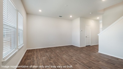San Antonio Applewood New Construction Homes spacious living room with natural light and plank flooring