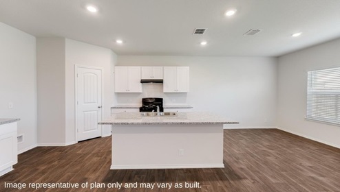 San Antonio Applewood New Construction Homes open concept kitchen and dining area with plan flooring kitchen island corner pantry white cabinets and black appliances