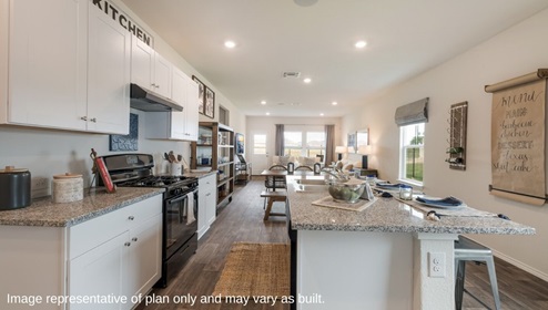 San Antonio Applewood New Construction Homes open concept kitchen dining living wall menu wall wine wrack white kitchen cabinets black appliances large kitchen island barstools farm table open shelving unit natural light