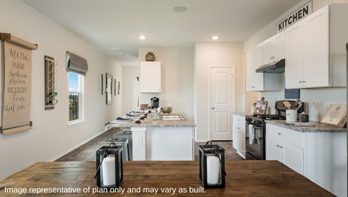 San Antonio Applewood New Construction Homes open concept kitchen white cabinets black appliances large kitchen island barstools corner pantry wall menu wall wine rack farm table with lantern decorations natural light