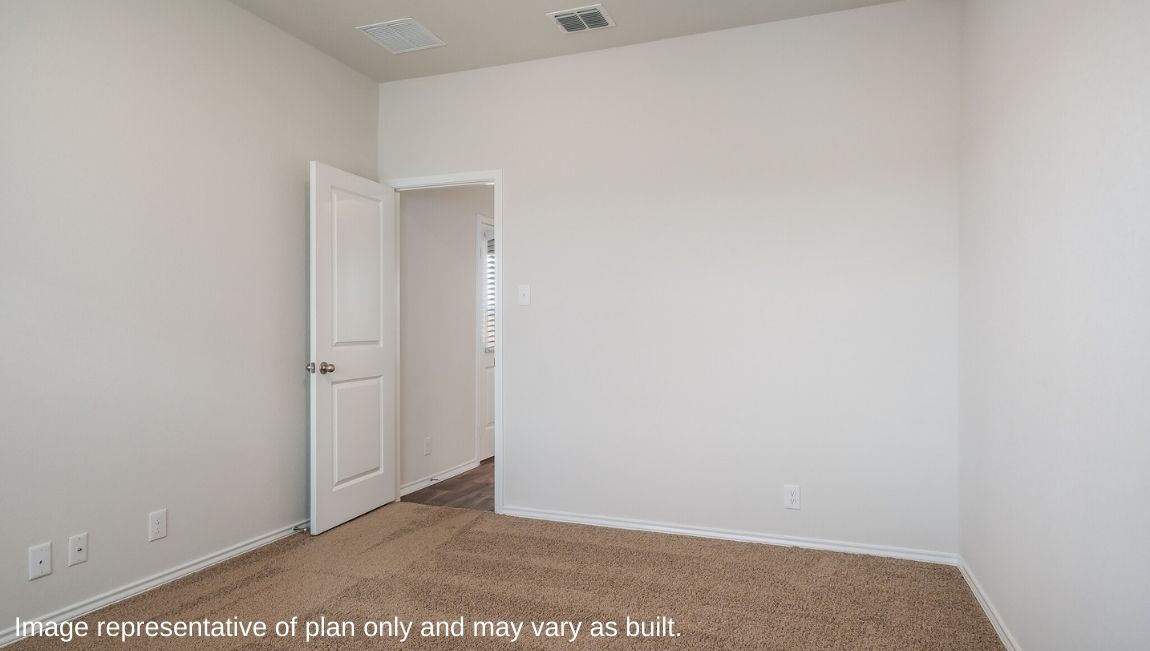 Spacious primary bedroom with quality carpet and ensuite bathroom.