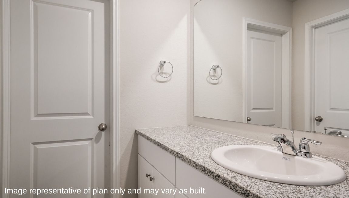 Second full bathroom with plenty of counterspace and walk in closet.