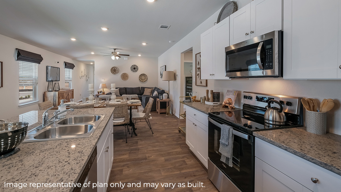 Open-concept kitchen with island and plenty of cabinet space.