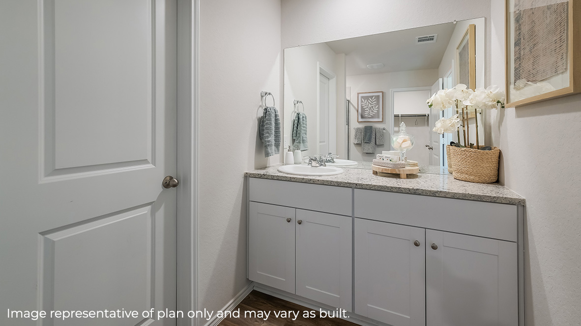Primary bathroom with plenty of counterspace and walk-in closet.