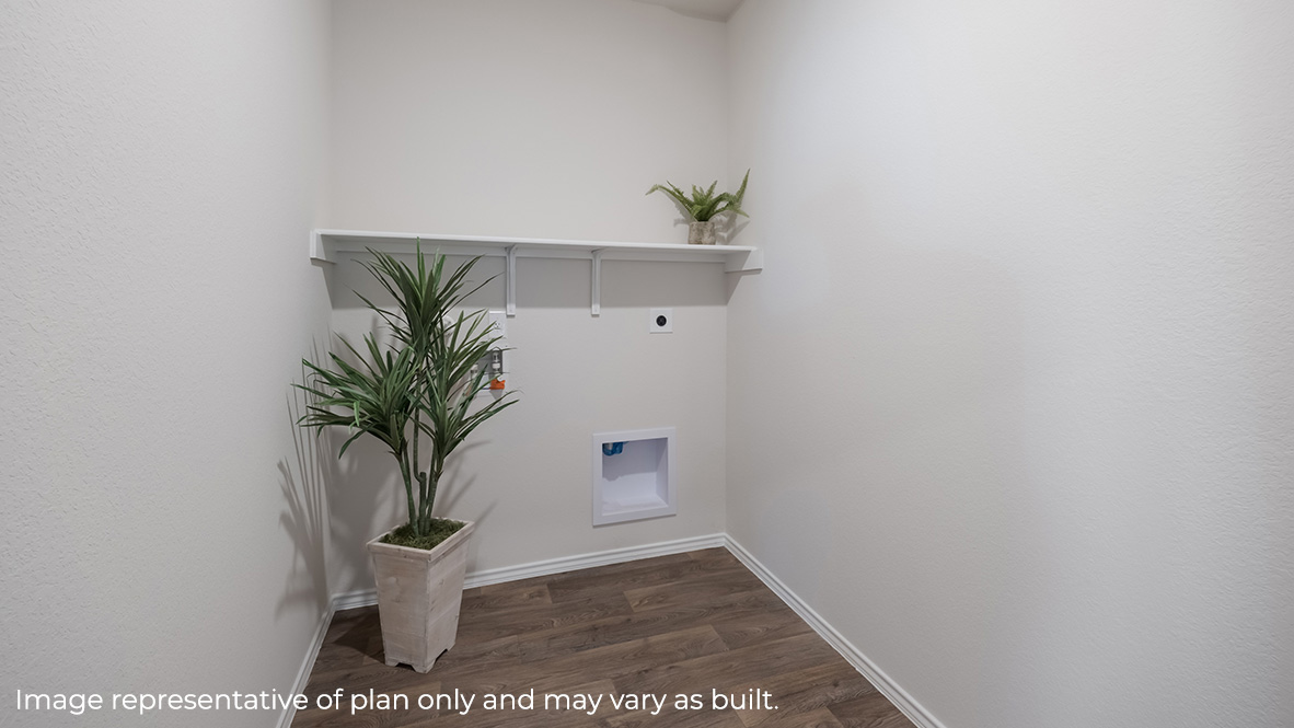 Spacious utility room with shelving.