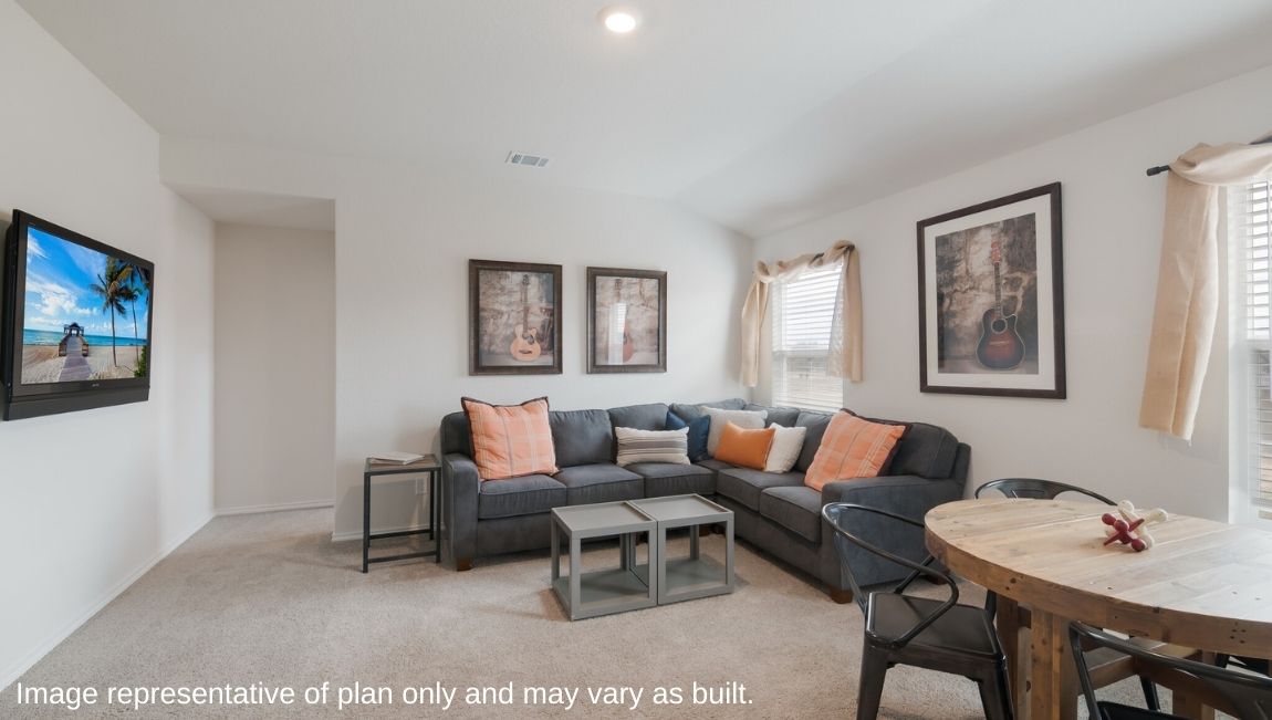 Spacious, open-concept loft at top of staircase with quality carpet and windows.