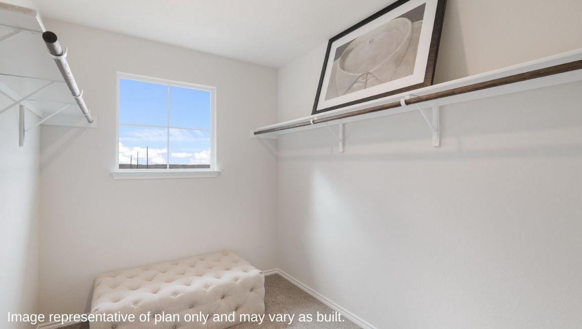 Secondary bedroom with quality carpet, window and closet.