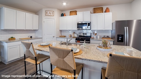 Open-concept kitchen with granite countertops, subway tile backsplash, stainless steel appliances and corner pantry