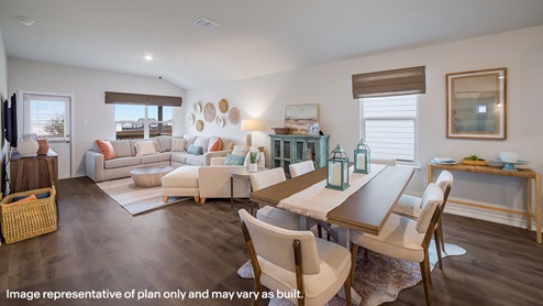 blended dining area and kitchen with hard surface flooring and large windows throughout