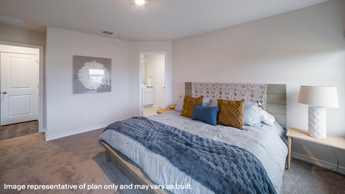 Primary bedroom with quality carpet and ensuite bathroom.